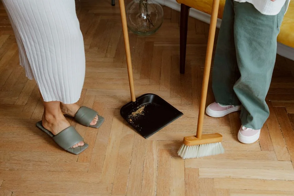Two people working together to carry a couch as they move into a new apartment.